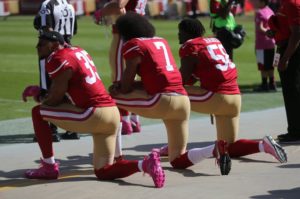 San Francisco 49ers' Eric Reid (35), San Francisco 49ers starting quarterback Colin Kaepernick (7) and San Francisco 49ers' Eli Harold (58) kneel during the national anthem before their game against the Tampa Bay Buccaneers for their NFL game at Levi's Stadium in Santa Clara, Calif., on Sunday, Oct. 23, 2016. (Nhat V. Meyer/Bay Area News Group)