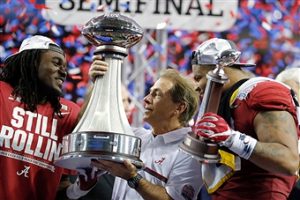 Ryan Anderson and Nick Saban after their win over the Washington Huskies last season.